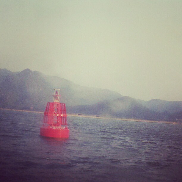 A buoy through a salt-stained window. #hongkong