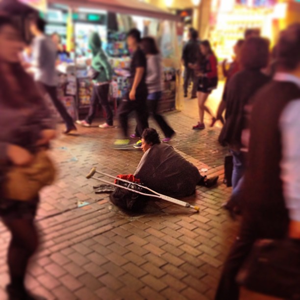 Alone in a crowd. The #beggar on the #streets of #mongkok #hongkong