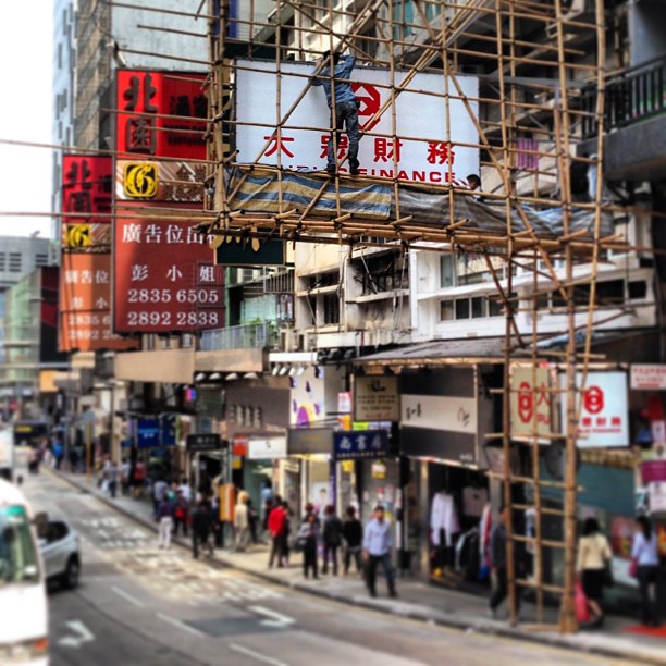 Man at #work. Hey, someone's gotta put up all those #signages! #hongkong