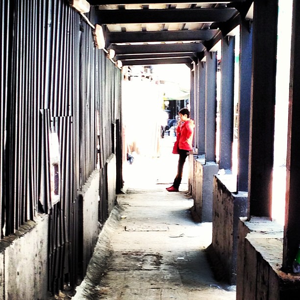 #lady in #red at the end of the #corridor. #hongkong