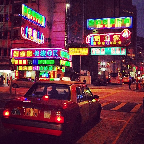 A #taxi waits on a #neon #street corner. #hongkong #hk #hkig