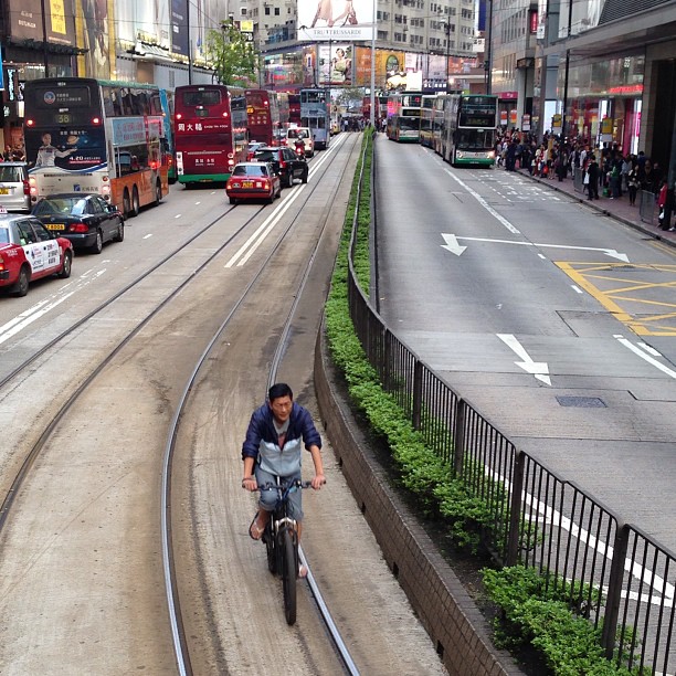 Riding a #bicycle along the #tram tracks in #causewaybay #hongkong. #hk #hkig