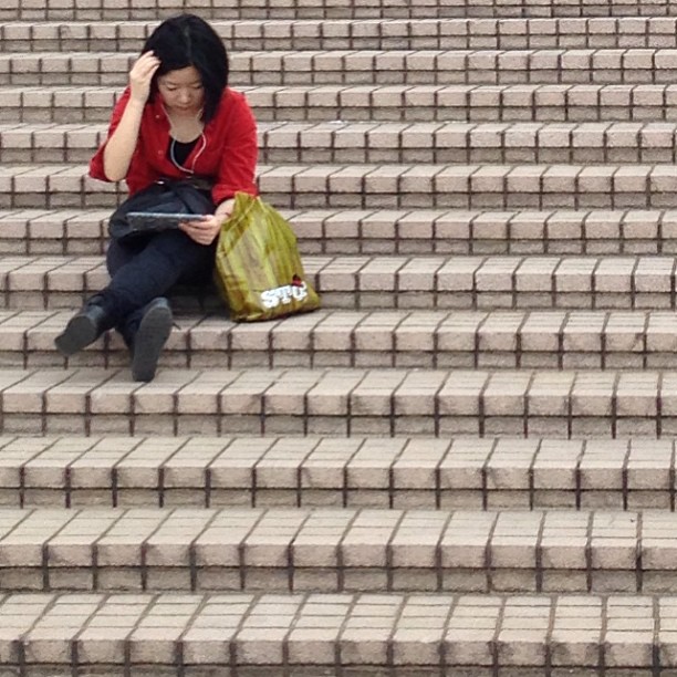 #womens #style #hongkong. A #lady #sitting, #reading on the #stairs. #hk #hkig
