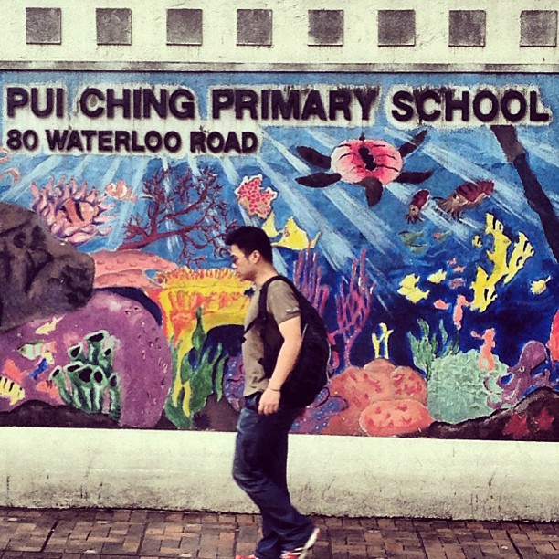 A #man walks past a #wall #mural #painting done by #primary #school #children. #hongkong #hk #hkig