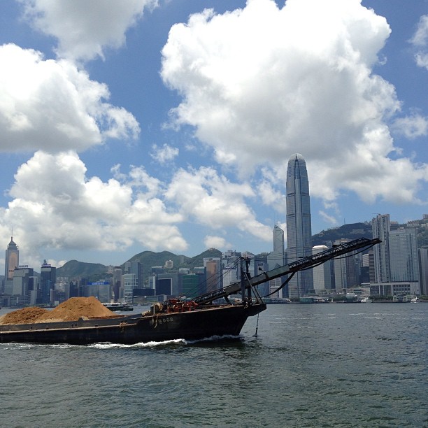 A #sand #barge crosses the harbour. #clouds #sky #sea #IFC #hongkong #hk #hkig