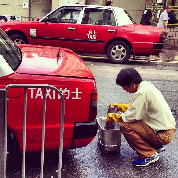 A #taxi #driver #washing his car in the #evening in preparation for the nightshift. #hkig #hongkong #hk