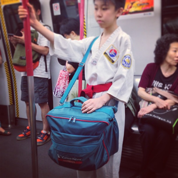 On the #mtr - #taekwondo #kid. Gosh that's a #large #bag! #hongkong #hk #hkig