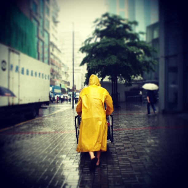 Work goes on - #yellow #raincoat in the #rain. #hongkong #hk #hkig