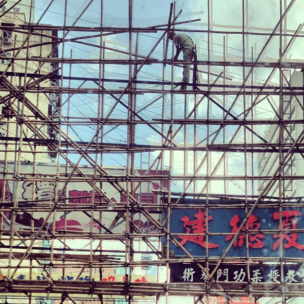 a #worker on #bamboo #scaffolding working on #neon #signs. #hongkong #hk #hkig