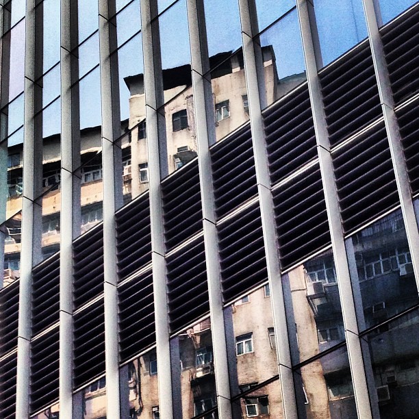 #old in #new - #reflections of old #buildings in the #glass facade of a modern office tower. #hongkong #hk #hkig