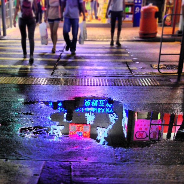 #reflections on #neon in a #puddle of #water as headless bodies stroll past. #hongkong #hk #hkig