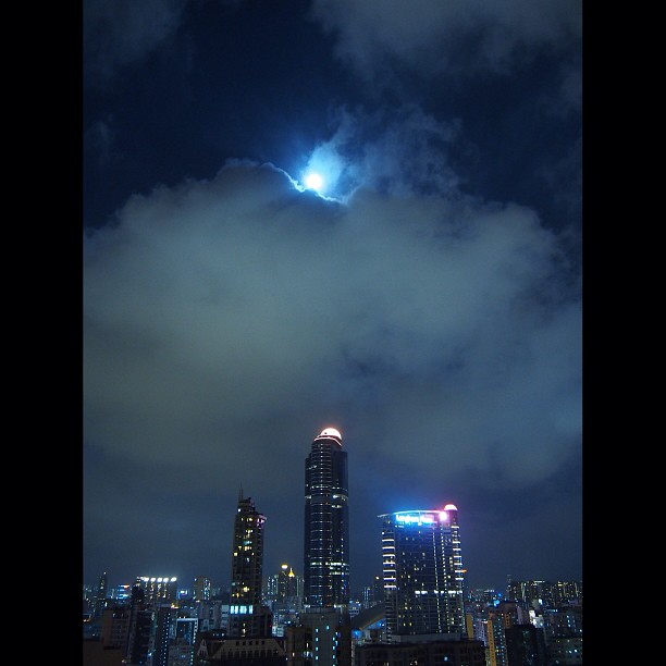 Happy #midautumn festival from #mongkok! The #moon peaks out from behind a curtain of #clouds. #hongkong #hk #hkig
