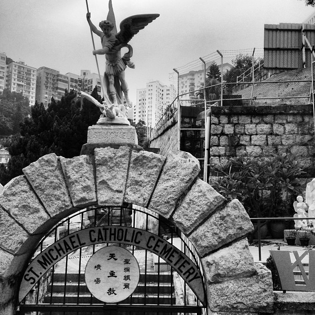 A #stone #angel guards the #gates of St. Michael's #Catholic #Cemetery. #hongkong #hk #hkig #mono