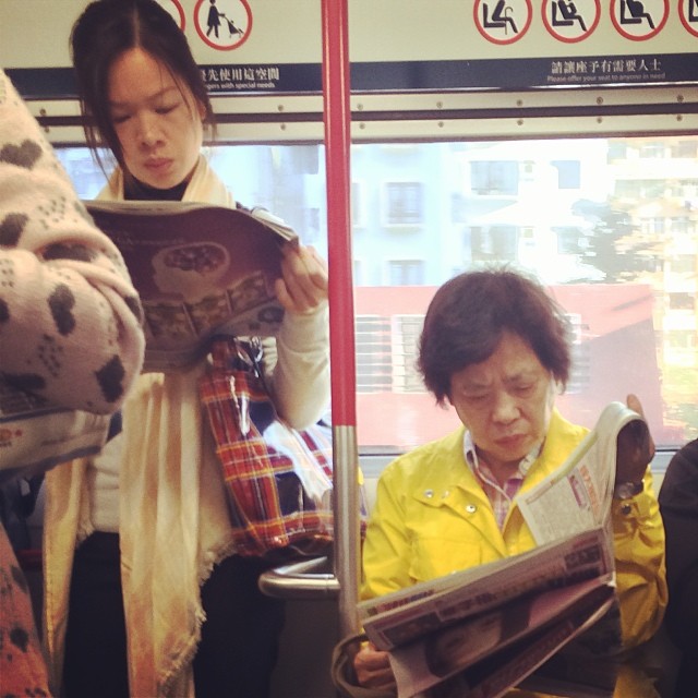 A slowly fading scene- #commuters #reading #newspapers on the #MTR #morning #commute. #hongkong #hk #hkig