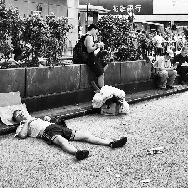 Dawn finds many of the #OccupyHK #protesters on #NathanRoad tired and resting. #mono #Mongkok #HongKong #hk #hkig