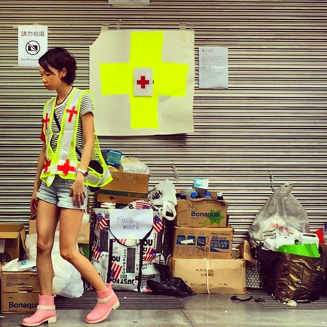 A #OccupyHK #firstaid volunteer in pink boots mans an aid station in #Mongkok. #HongKong #hk #hkig
