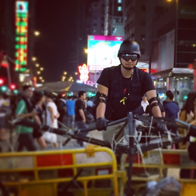 A #protester watches over the #barricade at #OccupyHK in #Mongkok... or does he? Seemed to be more like posing than anything else. #HongKong #hk #hkig
