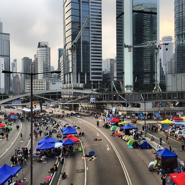 Dawn, 7.10am on day 8 of #OccupyHK in #Admiralty. Compared to the previous night, this crowd is extremely sparse. It's also a huge testament to the public transport system of #HongKong that it can move that many #protestors in and out of the protest area so quickly. #HK #hkig