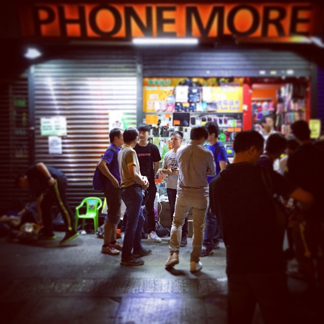 In the dead of night, a beacon of light. This small shop owner along #NathanRoad is still open at 12am and has set up a row of chargers outside his shop to allow #OccupyHK protestors to charge their phones. #Mongkok #HongKong #hk #hkig