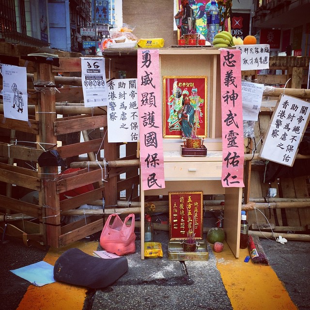 The #GuanYu / #GuanDi / #GuanGong #shrine at the #barricade on #NathanRoad in #Mongkok has organically grown. Note that there's even a cushion for you to kneel on! #OccupyHK #HongKong #hk #hkig