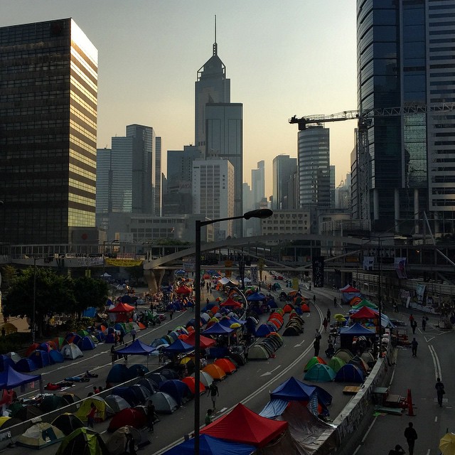 #dawn break on day 17 of #OccupyHK in #Admiralty. The #sunrise funds #HarcourtRoad a sea of #tents. #HongKong #hk #hkig