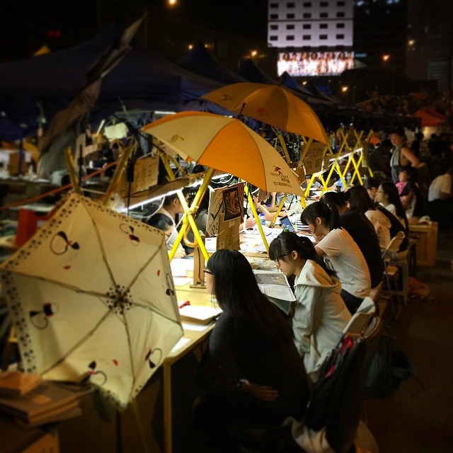 The amazing thing about the #OccupyHK study room on #HarcourtRoad in #Admiralty is not so much that there's a study room in the middle of the road but rather that the #students are actually #studying in it. They aren't goofing off, chatting or reading comics, they're actually doing homework and reading textbooks in there. Would that I were that studious. #HongKong #hk #hkig