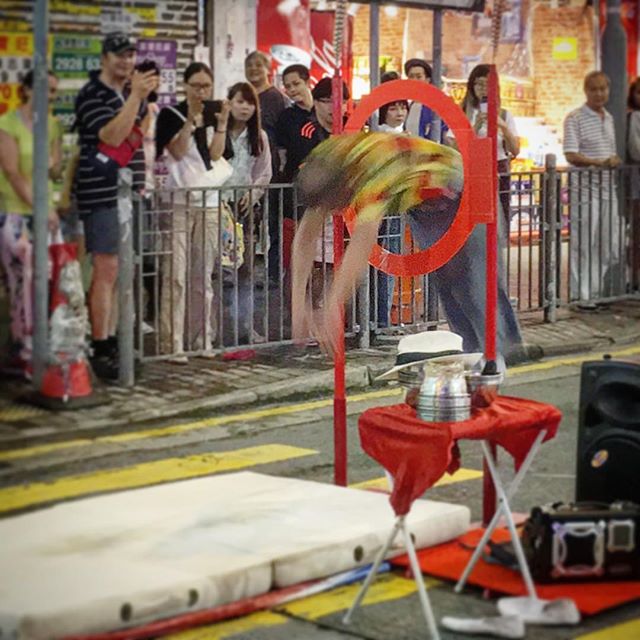 A #busker on #SaiYeungChoiStreet dives through a hoop during his performance. #Mongkok #hongkong #HK #HKIG