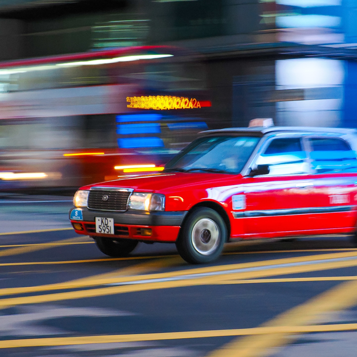 A Hong Kong taxi and bus zooming through Mongkok. hongkong hk hkig bus taxi mongkok speedline