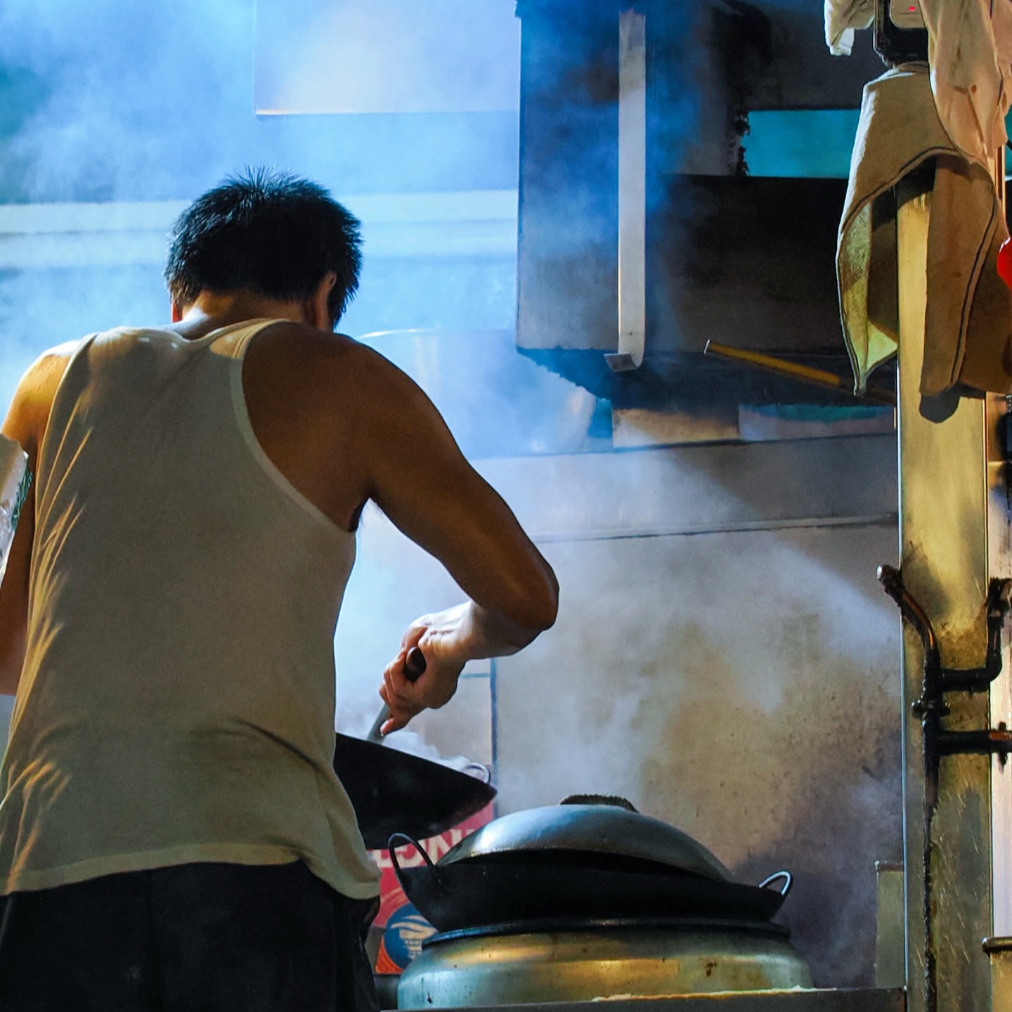 A chef cooks at a Daipaidong (street restaurant) in Central. Dai Pai Dongs (street restaurants) are a vanishing breed in Hong Kong as the government doesn’t hand out license for open air restaurants any longer. hongkong hk hkig daipaidong chef