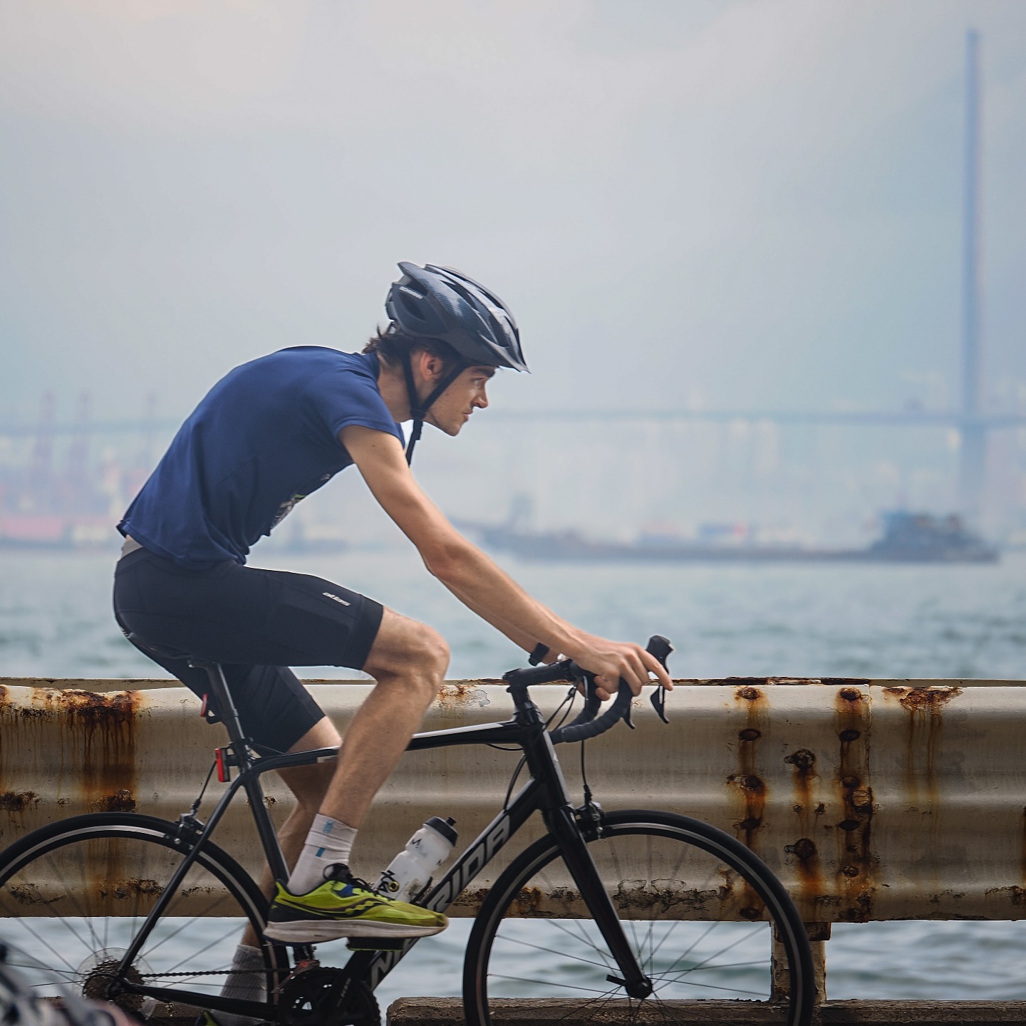 A cyclist along the Praya in Kennedy Town. hongkong hk hkig cyclist cycling kennedytown