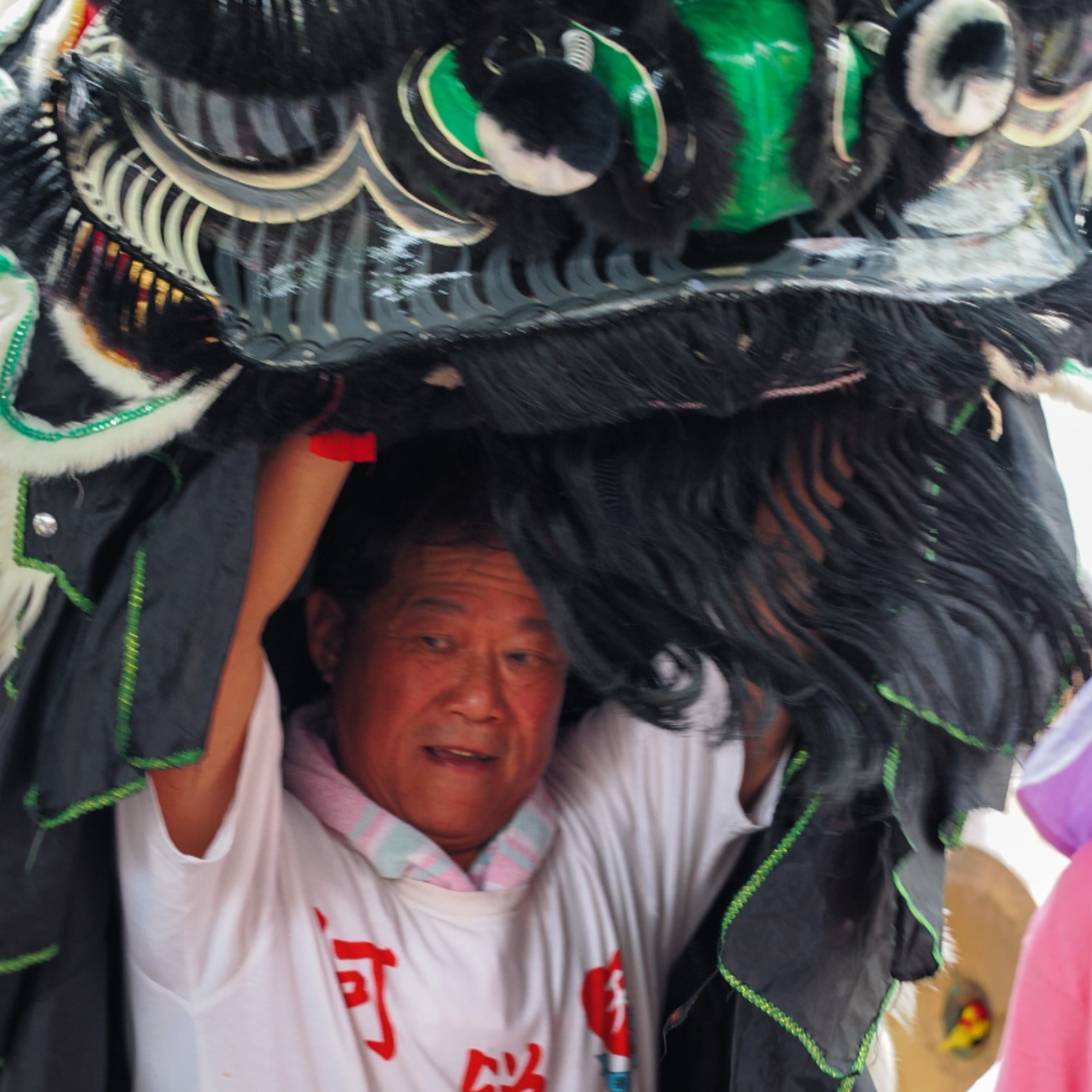 A Lion Dancer at the Tam Kung Birthday parade in Shau Kei Wan. hongkong hk hkig liondance tamkung shaukeiwan