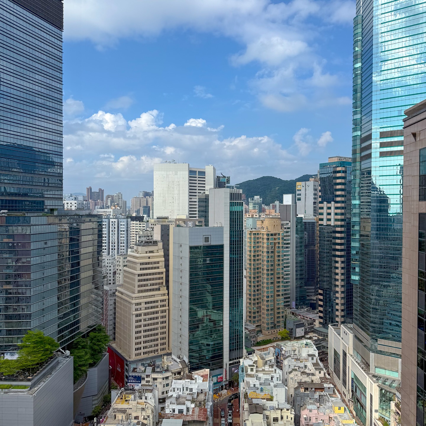 A patch of a sky sandwiched by skyscrapers. hongkong hk hkig causewaybay cityscape