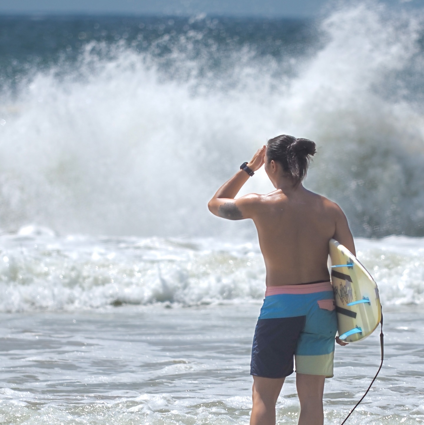 A surfer surveys the waves at Big Wave Bay, Hong Kong. hongkong hk hkig surfer surfing bigwavebay