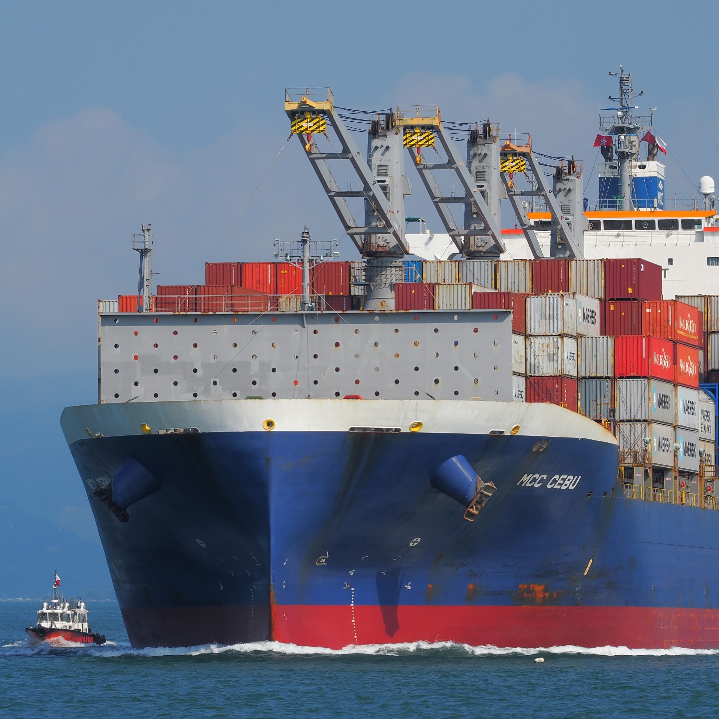 Scale. A MAERSK container ship and a pilot boat sailing through Hong Kong waters. hongkong hk hkig containership MAERSK pilotboat sea ship boat